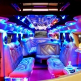 Luxury in the limo: the white one\'s front part - Hummer H2 Limo Transfer
